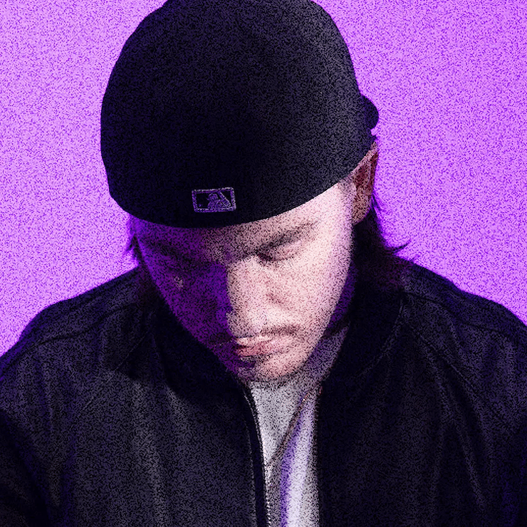 Press shot of Tommy Richman against a purple background